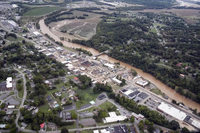 An aerial view of flood damage along the Pigeon River left by Hurricane Helene, Saturday, Sept. 28, 2024, in Newport, Tenn. (AP Photo/George Walker IV)