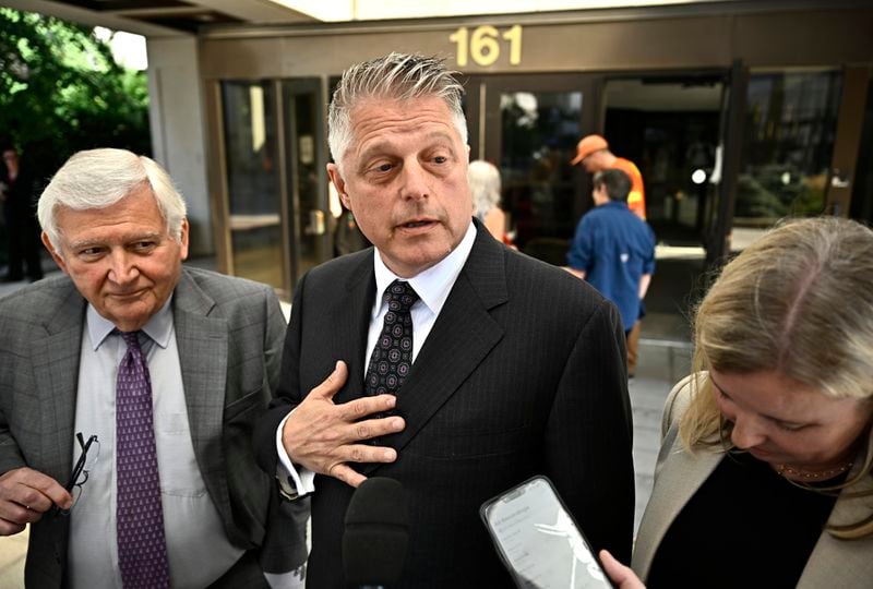 Former vice-admiral Haydn Edmundson, center, speaks outside the courthouse after being found not guilty of sexual assault and an indecent act, Monday, Sept. 16, 2024, in Ottawa. (Justin Tang/The Canadian Press via AP)