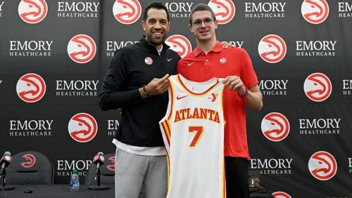 Atlanta Hawks Nikola Djurišić (right) and General Manager Landry Fields hold up Djurišić's jersey during a press conference at Emory Sports Medicine Complex, Friday, June 28, 2024, in Brookhaven. Atlanta Hawks General Manager Landry Fields introduced 2024 NBA Draft selections Zaccharie Risacher (first overall pick) and Nikola Djurisic (43th overall pick) during a press conference.(Hyosub Shin / Hyosub.Shin@ajc.com)