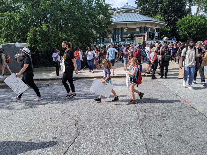 People in Decatur, including kids, leave the site of the Wednesday demonstration provoked by police violence against black people