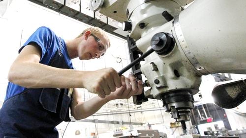 The author of a new book on rethinking the straight-to-college path says more high schools ought to offer apprenticeships that allow students to experience different kinds of work and workplaces to see what interests them. Here, an Ohio high school senior works as an apprentice for Dysinger Inc. in Dayton, Ohio. (Ty Greenlees / file photo)