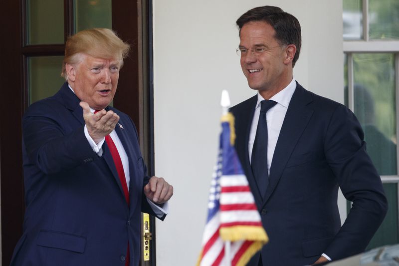 FILE - President Donald Trump greets Dutch Prime Minister Mark Rutte as he arrives at the White House in Washington, Thursday, July 18, 2019. Over the course of more than a dozen years at the top of Dutch politics, Mark Rutte got to know a thing or two about finding consensus among fractious coalition partners. Now he's going to bring the experience of leading four Dutch multiparty governments to the international stage as NATO's new secretary general. (AP Photo/Carolyn Kaster, File)