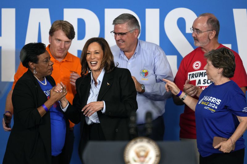 Democratic presidential nominee Vice President Kamala Harris greets labor leaders after speaking at a campaign event at Northwestern High School in Detroit, Monday, Sept. 2, 2024. (AP Photo/Paul Sancya)