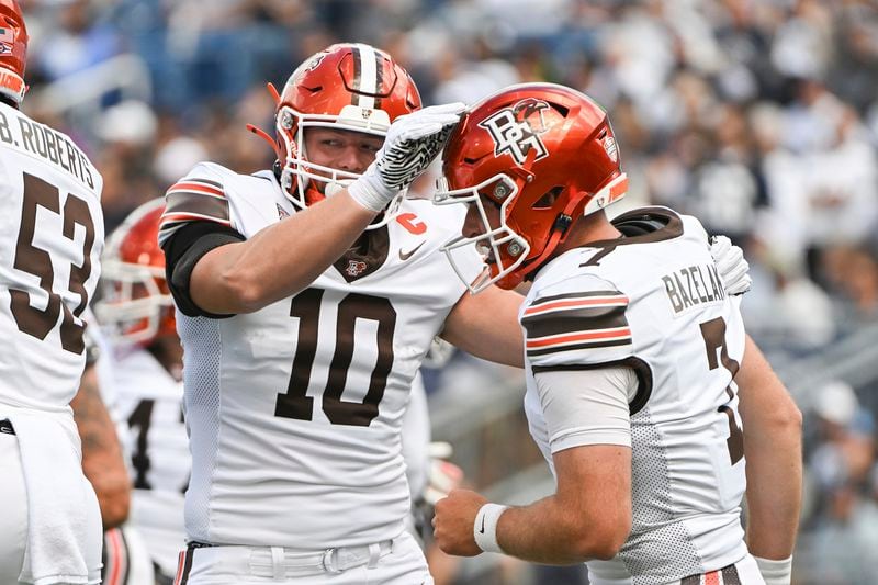 Bowling Green quarterback Connor Bazelak (7) celebrates a touchdown with tight end Levi Gazarek (10) during the first quarter of an NCAA college football game against Penn State, Saturday, Sept. 7, 2024, in State College, Pa. (AP Photo/Barry Reeger)