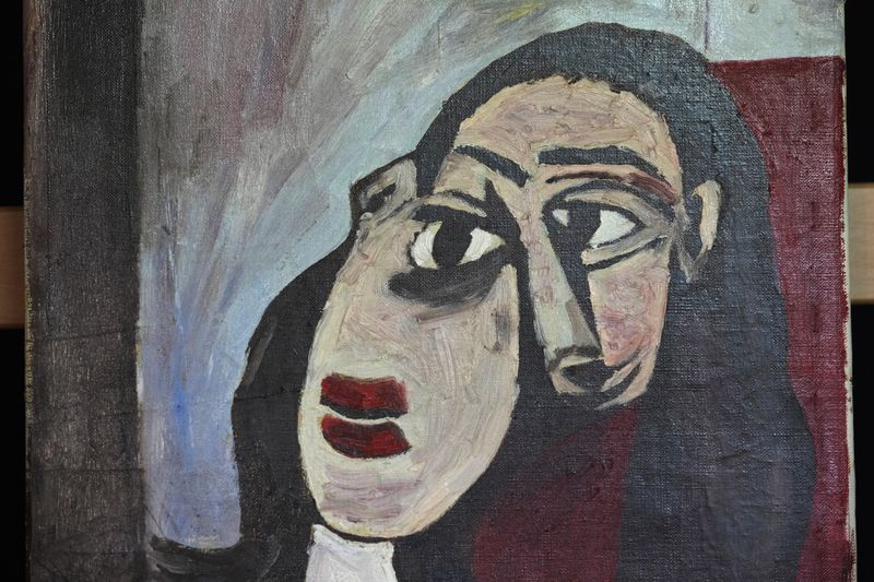 A painting is seen at a restoration laboratory in Milan, Italy, Thursday, Oct. 3, 2024. An Italian family hopes to prove definitively that a painting discarded from a villa on Capri more than 60 years ago is a Picasso. (AP Photo/Antonio Calanni)