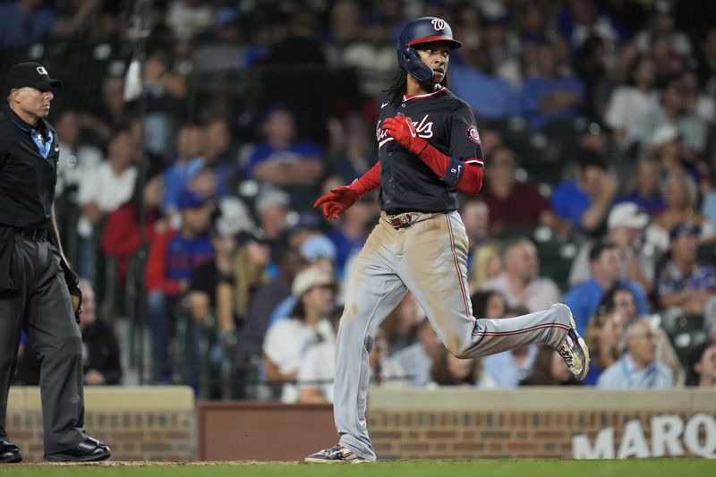 Washington Nationals' CJ Abrams scores on a double from James Wood during the third inning of a baseball game against the Chicago Cubs, Thursday, Sept. 19, 2024, in Chicago. (AP Photo/Erin Hooley)