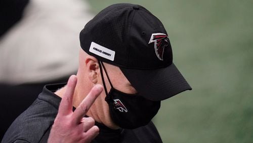 Atlanta Falcons head coach Dan Quinn gestures to fans as he walks off the field after 23-16 loss to  the Carolina Panthers, Sunday, Oct. 11, 2020, at Mercedes-Benz Stadium in Atlanta. (Brynn Anderson/AP)