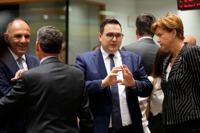 Czech Republic's Foreign Minister Jan Lipavsky, second right, speaks with Latvia's Foreign Minister Baiba Braze during a meeting of EU foreign ministers at the European Council building in Brussels, Thursday, Aug. 29, 2024. (AP Photo/Virginia Mayo)