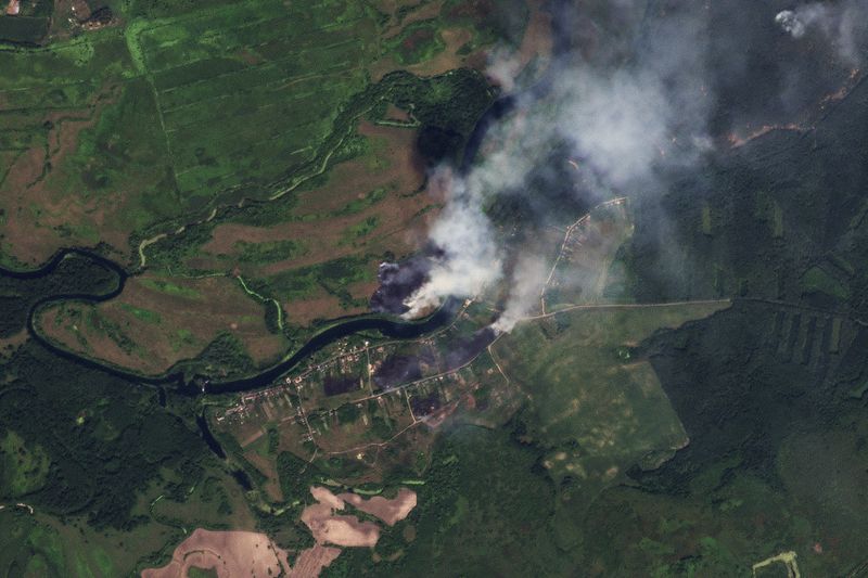 This satellite image released by Planet Labs PBC shows fires near the village of Krasnooktyabrskoe in Russia's Kursk region on Tuesday, Aug. 20, 2024. (Planet Labs PBC via AP)