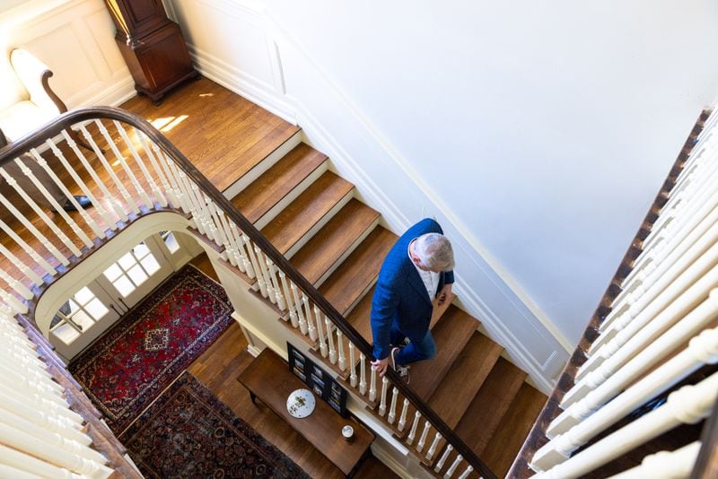 Roger Smith walks the stairs at his historic home, which barely escaped the wrecking ball, before he and his partner Christopher Jones had it moved from Buckhead to Ansley Park. (Arvin Temkar / arvin.temkar@ajc.com)