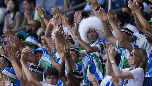 Uzbekistan fans react during the men's group C match between Uzbekistan and Spain at the Parc des Princes during the 2024 Summer Olympics, Wednesday, July 24, 2024, in Paris, France. (AP Photo/Rebecca Blackwell)