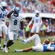 Kentucky defensive lineman Octavious Oxendine (8) reacts after sacking Mississippi quarterback Jaxson Dart (2) during the first half of an NCAA college football game against Mississippi Saturday, Sept. 28, 2024, in Oxford, Miss. (AP Photo/Randy J. Williams)