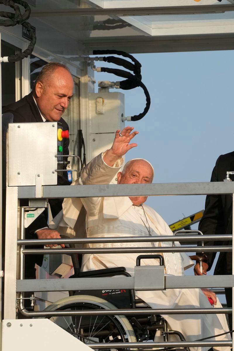 Pope Francis arrives at Fiumicino International airport Leonardo da Vinci, some 30 kilometers south-west of Rome, Thursday, Sept. 26, 2024 to board the papal flight to Luxembourg for a four-day visit to Luxembourg and Belgium. (AP Photo/Gregorio Borgia)