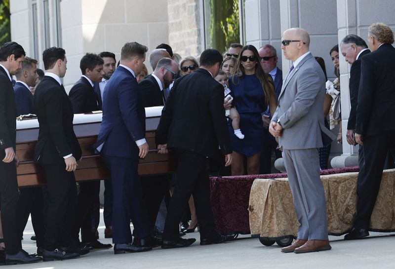 Pallbearers carry the casket of Columbus Blue Jackets hockey player John Gaudreau before funeral services for Gaudreau and his brother Matthew Gaudreau at Saint Mary Magdalen Church in Media, Pa., Monday, Sept. 9, 2024. (Yong Kim/The Philadelphia Inquirer via AP)