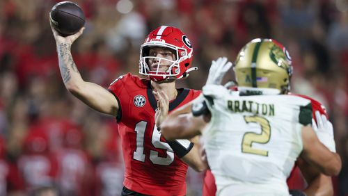 Georgia quarterback Carson Beck (15) attempts a pass against the defensive pressure of UAB linebacker Jackson Bratton (2) during the second quarter at Sanford Stadium, Saturday, September 23, 2023, in Athens, Ga. (Jason Getz / Jason.Getz@ajc.com)