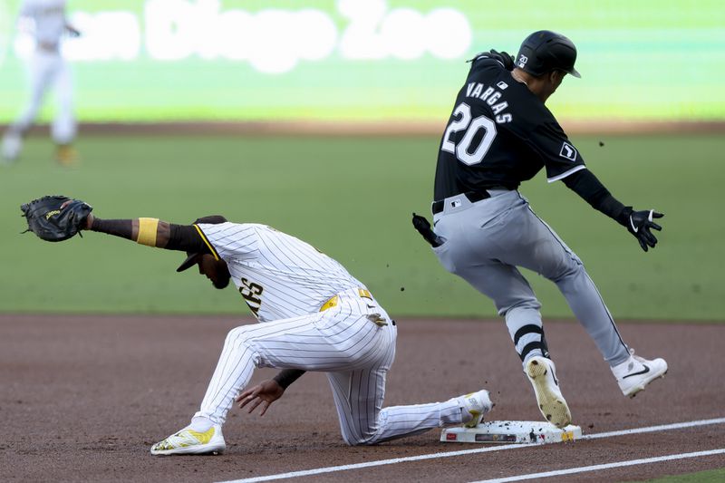 San Diego Padres first baseman Luis Arraez, left, forces out Chicago White Sox's Miguel Vargas during the first inning of a baseball game, Saturday, Sept. 21, 2024, in San Diego. (AP Photo/Ryan Sun)