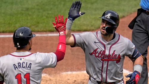 Atlanta Braves' Adam Duvall, right, is greeted by teammate Orlando Arcia (11) after hitting a solo home run off Pittsburgh Pirates relief pitcher Aroldis Chapman during the eighth inning of a baseball game in Pittsburgh, Sunday, May 26, 2024. (AP Photo/Gene J. Puskar)