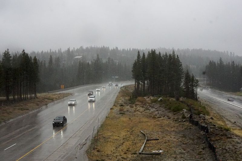 Motorists make their way along a rain-soaked Interstate 80 Saturday, Aug. 24, 2024, in Donner Summit, Calif. (AP Photo/Brooke Hess-Homeier)