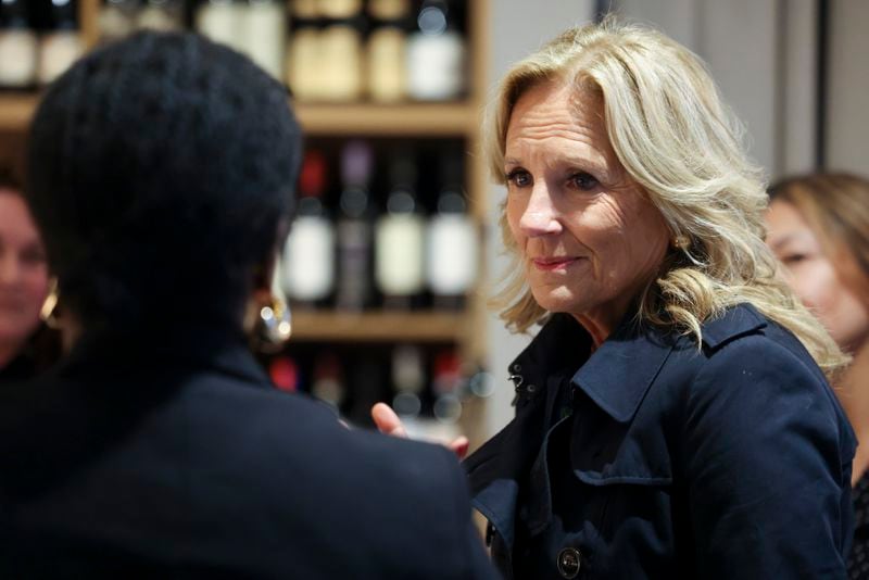 First lady Jill Biden talks Friday to Sarah Pierre, left, at her store 3 Parks Wine in Atlanta's Old Fourth Ward. Biden traveled to Georgia to launch Women for Biden-Harris, a national organizing program to reach and mobilize women across the country to reelect Joe Biden and Kamala Harris.  (Jason Getz / jason.getz@ajc.com)