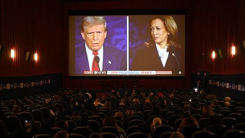 Supporters for Vice President Kamala Harris watch the presidential debate between Republican presidential nominee former President Donald Trump and Democratic presidential nominee Vice President Kamala Harris during a Democrat Debate watch party at Tara Theater, Tuesday, September 10, 2024, in Atlanta. The ABC News debate, which begins at 9 p.m., is expected to be the only chance for voters to see the two rivals in a side-by-side confrontation this election season. (Hyosub Shin / AJC)