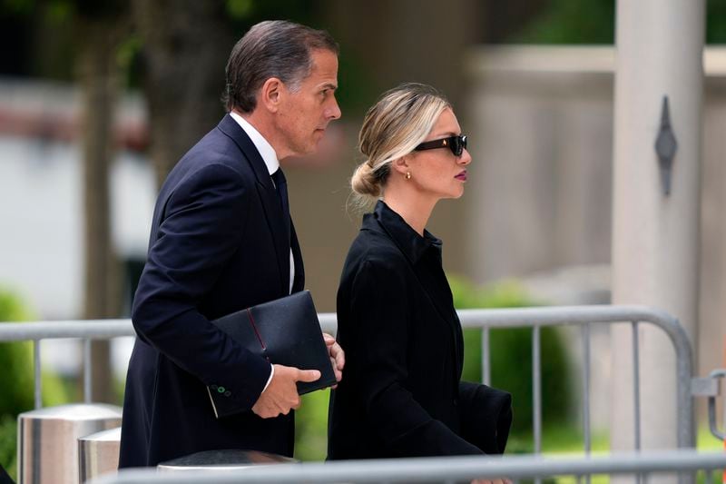 Hunter Biden, accompanied by his wife, Melissa Cohen Biden, arrive at federal court, Wednesday, June 5, 2024, in Wilmington, Del. (AP Photo/Matt Rourke)