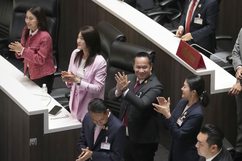 Pheu Thai party lawmakers celebrate after Thailand’s Parliament elected the party's leader Paetongtarn Shinawatra as the country’s new prime minister at Parliament in Bangkok, Thailand, Friday, Aug. 16, 2024. (AP Photo/Sakchai Lalit)