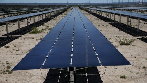 In a file photo, solar panels soak up the sun at a West Texas facility under contract with Austin Energy.