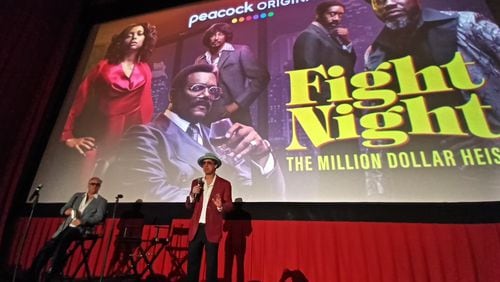 Jeff Keating (right) and his podcast co-writer Jim Roberts speak before the screening of "Fight Night: The Million Dollar Heist" at the Tara Theatre on Sept. 7." 
Credit: Blake Guthrie