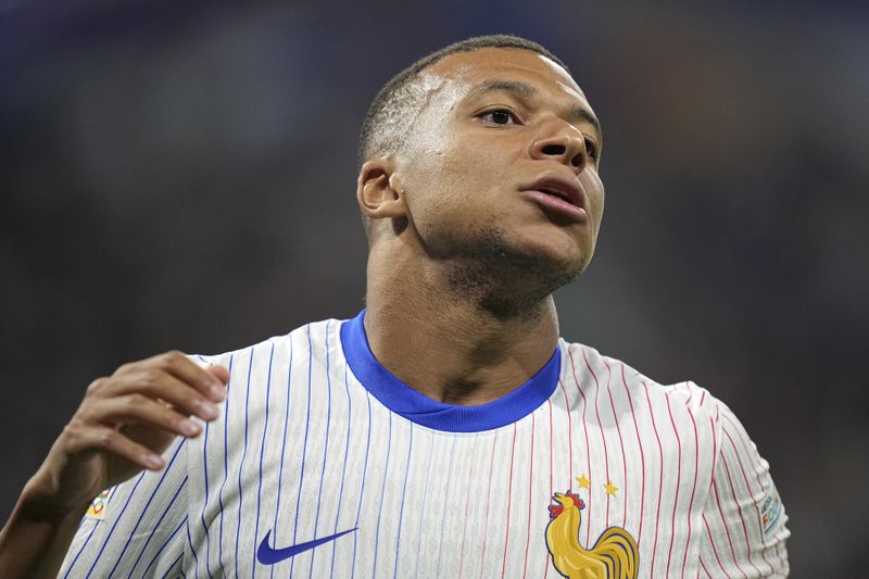 France's Kylian Mbappe reacts during the UEFA Nations League soccer match between France and Belgium at the Groupama stadium in Decines, outside Lyon, France, Monday, Sept. 9, 2024. (AP Photo/Laurent Cipriani)