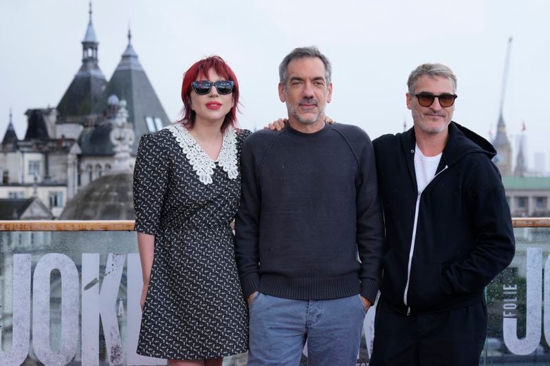 Director Todd Phillips, center, and actors Lady Gaga and Joaquin Phoenix pose for photographers upon arrival at the photo call for the film 'Joker: Folie a Deux' in London, Thursday, Sept. 26, 2024. (AP Photo/Kirsty Wigglesworth)