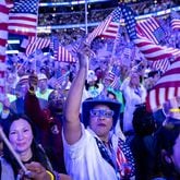 Through four days of flag waving, sign holding, “USA” chanting and lengthy declarations of devotion to democracy, the Democratic National Convention was a full-throated declaration that Democrats can love America, too. And do. (Arvin Temkar / AJC)