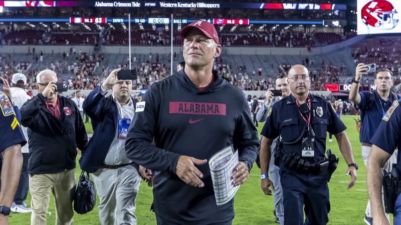 After his first game as head coach, Alabama's Kalen DeBoer, center, walks off the field after an NCAA college football game against Western Kentucky, Saturday, Aug. 31, 2024, in Tuscaloosa, Ala. (AP Photo/Vasha Hunt)