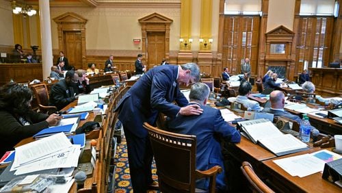 February 24, 2022 Atlanta - Sen. Marty Harbin (R-Tyrone), standing, confers with Sen. John Kennedy (R-Macon) after he introduced SB-435 in the Senate Chambers at the Georgia State Capitol on Thursday, February 24, 2022. Senate Bill 435 would ban schools from allowing transgender girls from participating in sports that align with their gender identity. SB-435 passed in the Senate Chambers. (Hyosub Shin / Hyosub.Shin@ajc.com)