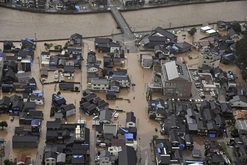 This aerial photo shows the flooded area after heavy rain in Wajima, Ishikawa prefecture, Saturday, Sept. 21, 2024. (Kyodo News via AP)