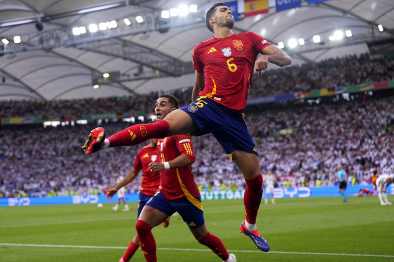 Spain's Mikel Merino celebrates after scoring his sides second goal during a quarter final match between Germany and Spain at the Euro 2024 soccer tournament in Stuttgart, Germany, Friday, July 5, 2024. (AP Photo/Manu Fernandez)