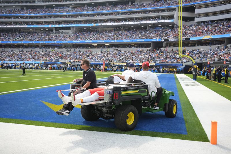 Kansas City Chiefs wide receiver Rashee Rice is taken off the field on a cart after being injured during the first half of an NFL football game against the Los Angeles Chargers Sunday, Sept. 29, 2024, in Inglewood, Calif. (AP Photo/Ashley Landis)