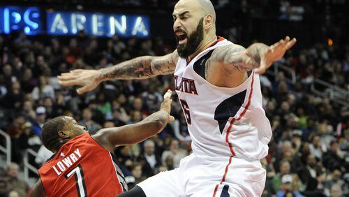 Atlanta Hawks forward Pero Antic (6), of Macedonia, plays against Toronto Raptors guard Kyle Lowry (7) during the second half of an NBA basketball game, Friday, Feb. 20, 2015, in Atlanta. Toronto won 105-80. (AP Photo/John Amis)