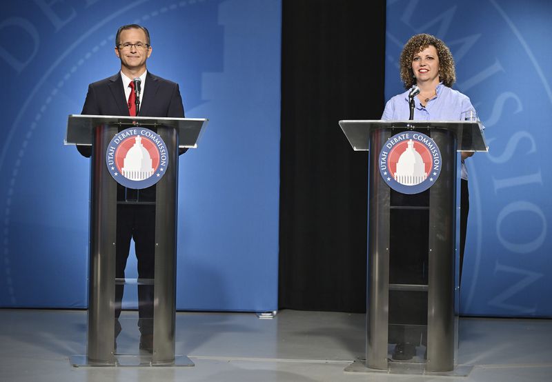 FILE - U.S. Rep. Celeste Maloy, right, R-Utah, and Colby Jenkins look on during Utah's 2nd Congressional district debate on Monday, June 10, 2024, at the University of Utah, in Salt Lake City. Trump-backed Maloy is seeking her first full term on Capitol Hill after winning a special election last fall. She faces challenger Jenkins, a retired U.S. Army officer and telecommunications specialist, who is endorsed by Romney's counterpart, U.S. Sen. Mike Lee. (Scott G. Winterton/The Deseret News via AP, Pool, File)