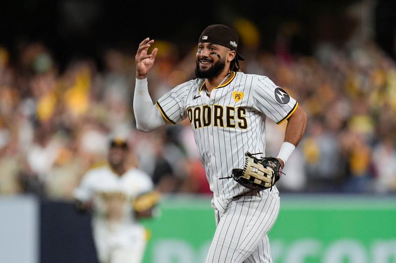 San Diego Padres' Fernando Tatis Jr. smiles after a win over the Atlanta Braves in Game 2 of an NL Wild Card Series baseball game Wednesday, Oct. 2, 2024, in San Diego. (AP Photo/Gregory Bull)