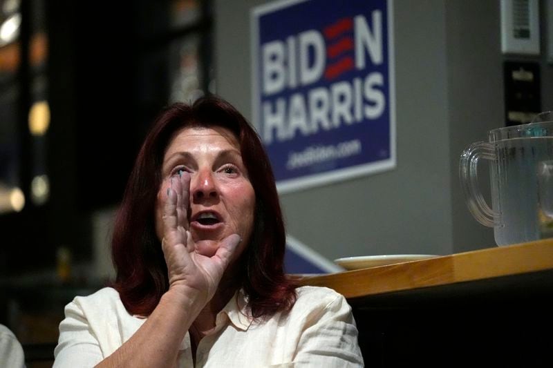 Lynn Miller shouts at the TV after a comment by Republican presidential candidate former President Donald Trump during the presidential debate with President Joe Biden, during a watch party at Broadway Bowl, Thursday, June 27, 2024, in South Portland, Maine. (AP Photo/Robert F. Bukaty)