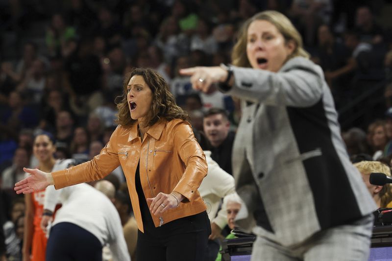 Connecticut Sun head coach Stephanie White reacts to a play during the second half of Game 1 of a WNBA basketball semifinals series against the Minnesota Lynx, Sunday, Sept. 29, 2024, in Minneapolis. (AP Photo/Stacy Bengs)