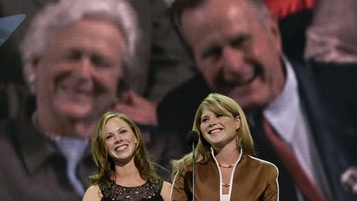 President Bush's daughters, Barbara, left, and Jenna Bush, are framed by their grandparents, former President George H. W. Bush, right, and Barbara Bush as they speak to delegates at Madison Square Garden during the Republican National Convention in New York, Tuesday, Aug. 31, 2004. (AP Photo/Stephan Savoia)