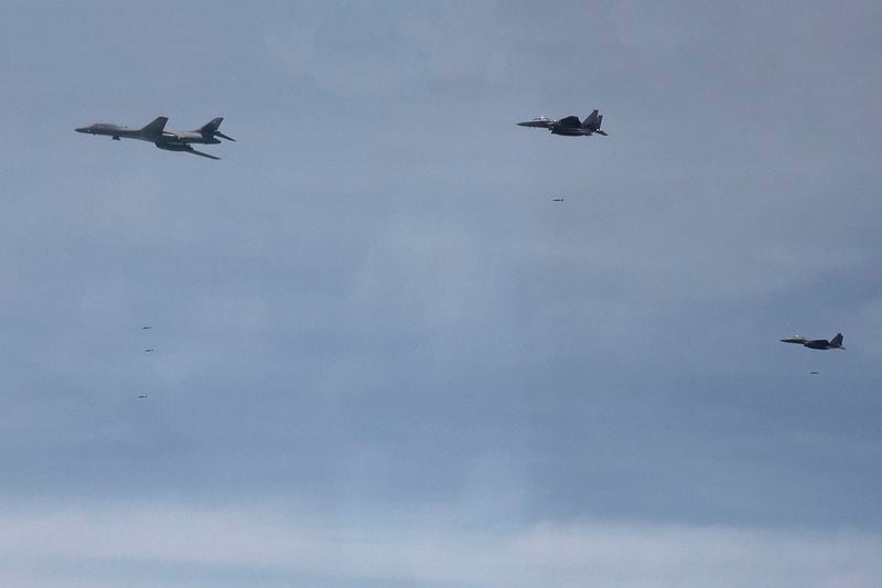 In this photo provided by the South Korea Defense Ministry, U.S. Air Force B-1B bomber, left, and South Korean fighter jets F-15K fly over the Korean Peninsula during the joint aerial drills between South Korea and the United States, South Korea, Wednesday, June 5, 2024. (South Korea Defense Ministry via AP)