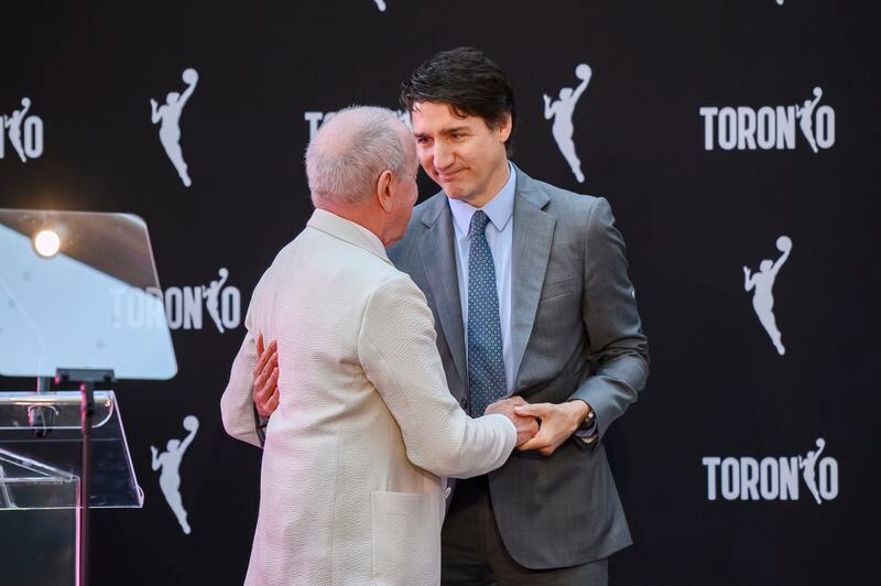 Larry Tanenbaum of Kilmer Sports Ventures, left, and Canada's Prime Minister Justin Trudeau speak following a press conference announcing Toronto's WNBA franchise, in Toronto on Thursday, May 23, 2024. (Christopher Katsarov/The Canadian Press via AP)