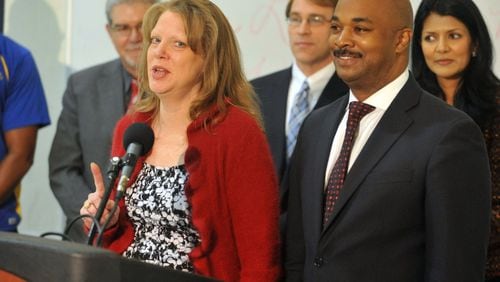 Kwanza Hall, right, authored legislation that eliminates a question about criminal records from the city of Atlanta’s job application. Atlanta Councilperson Carla Smith is on the left.