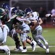 Marist's Champ Davis (10) gets tackled by Blessed Trinity's Mavrick Torrico (32) in the second half at Blessed Trinity Catholic High School in Roswell on Friday, August 27, 2021. Marist won 28-13 over Blessed Trinity. (Hyosub Shin / Hyosub.Shin@ajc.com)