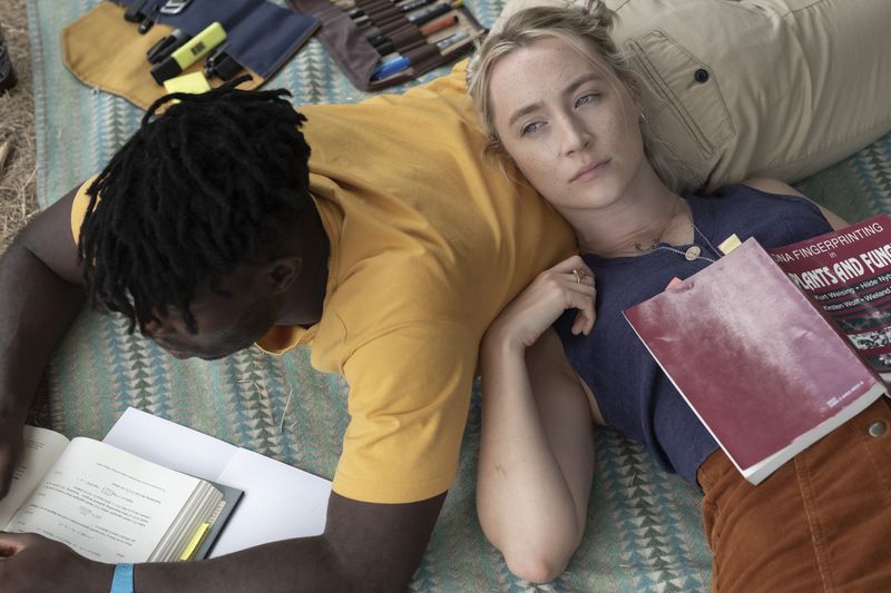 This image released by Sony Pictures Classics shows Paapa Essiedu, left, and Saoirse Ronan in a scene from "The Outrun." (Sony Pictures Classics via AP)