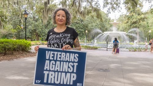 Air Force vet Tabatha Strozier of Savannah said she had a hard time choosing which campaign sign to order for her yard. One option was “Veterans For Biden.” Another was “Veterans Against Trump.” Then President Joe Biden ended his campaign. “Now, with Kamala Harris as the nominee instead of Biden," she said, "I’m really glad I went anti-Trump.” (AJC Photo/Katelyn Myrick)