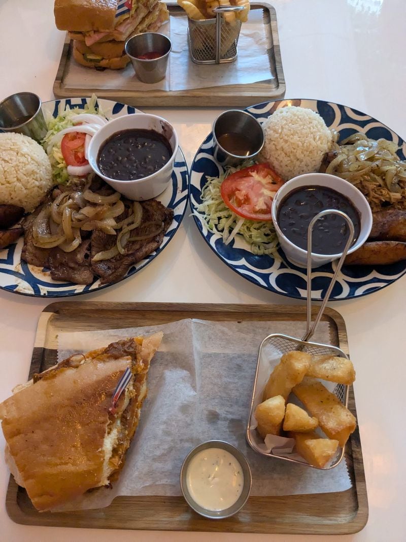 Azucar Cuban Cuisine offers a variety of sandwiches and entrees, including such dishes as ropa vieja, lechon asado and palomilla steak. (Paula Pontes for The Atlanta Journal-Constitution)