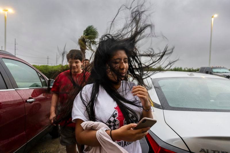 Melanie Galindo's hair flies in the swirl of fast-moving air as the eye wall of Hurricane Francine crosses into the Houma area in Louisiana on Wednesday, September 11, 2024. (Chris Granger, The Times-Picayune via AP)